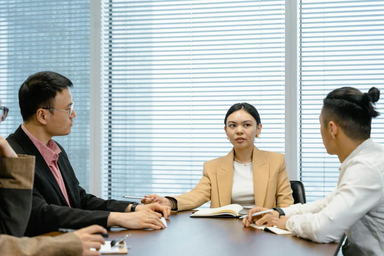 a group of people sitting around a wooden table, by Yasushi Sugiyama, pexels contest winner, realism, female lawyer, in tokio, in a meeting room, zeen chin and terada katsuya