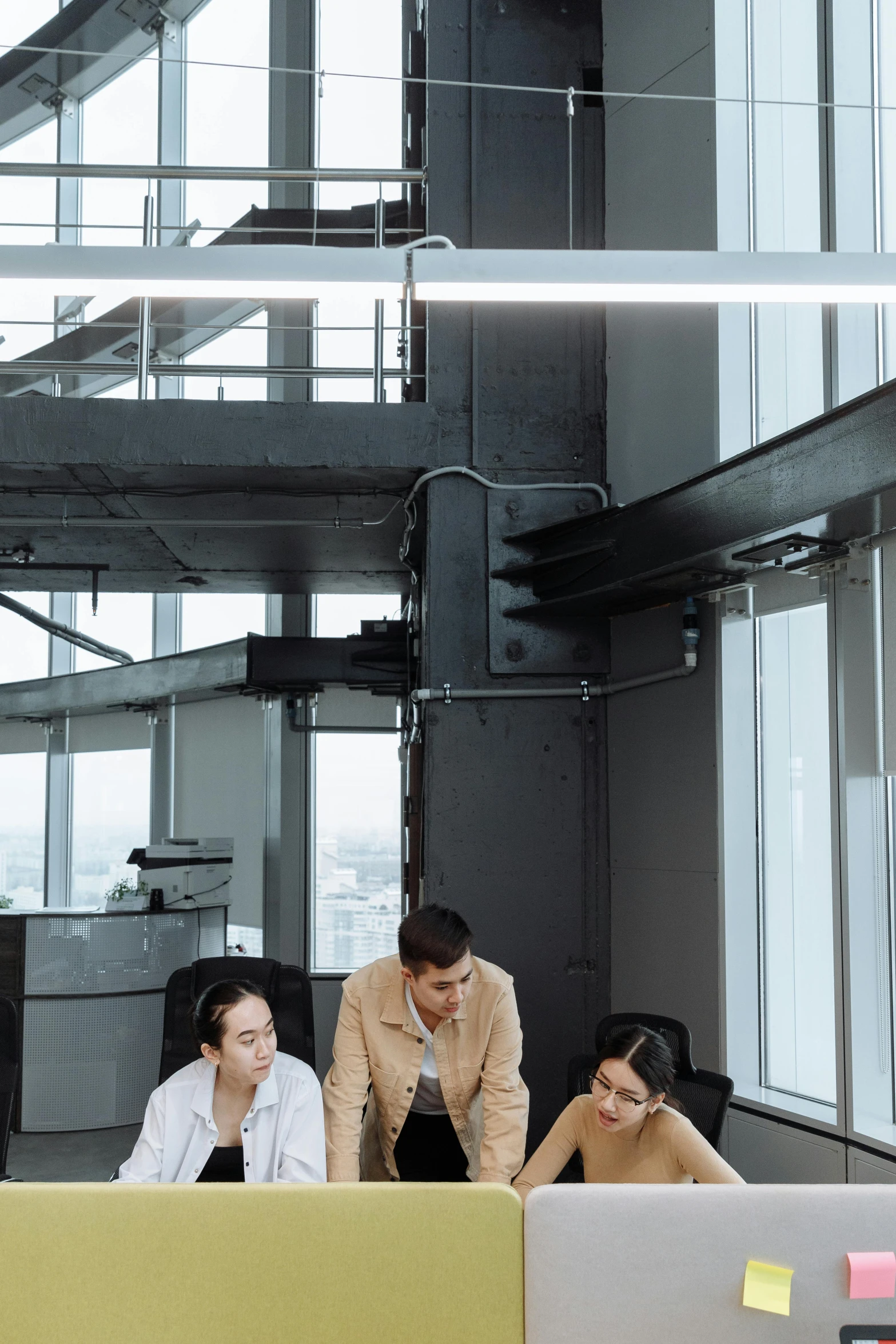 a group of people working on laptops in an office, by Sebastian Vrancx, pexels contest winner, renaissance, tall metal towers, asian descend, commercial banner, vertical orientation