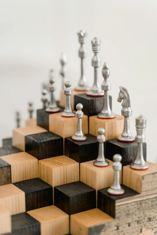 a wooden chess board with chess pieces on it, inspired by Peter de Sève, kinetic art, silver, up close image, upcycled, detailed product image