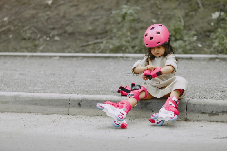 a little girl sitting on the curb with her skateboard, pexels contest winner, streamlined pink armor, wearing helmet, animation, riyahd cassiem