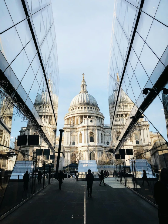 the dome of st paul's cathedral is reflected in the glass of a building, a photo, pexels contest winner, elegant walkways between towers, 🦩🪐🐞👩🏻🦳, 4 k -, on a great neoclassical square