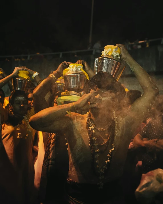 a group of people with buckets on their heads, a picture, trending on unsplash, samikshavad, acid rains. the sacred nipple, ornately dressed, holy glow, lgbtq