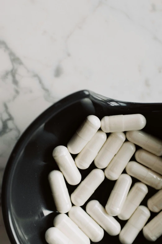 a black bowl filled with white pills on top of a table, instagram post, alessio albi, bandoliers, multiple stories