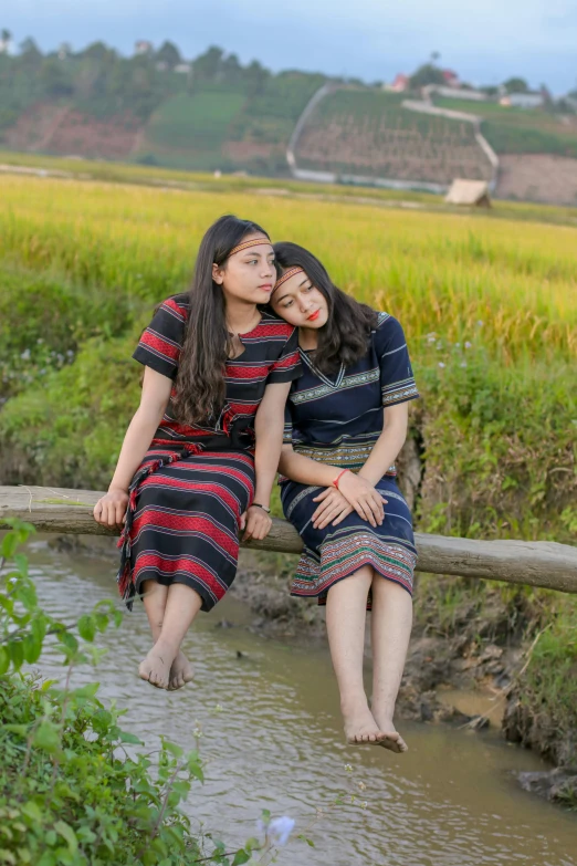 a couple of women sitting on top of a wooden bridge, a picture, inspired by Ruth Jên, sumatraism, sitting in a field, avatar image, vietnam, cute photo