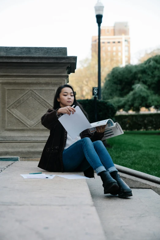 a woman sitting on the ground reading a book, academic art, humans of new york, asian descent, 2019 trending photo, tall female emo art student