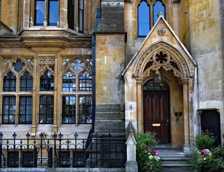 a red fire hydrant sitting in front of a building, inspired by Christopher Wren, flickr, arts and crafts movement, symmetrical doorway, gothic library, inside a grand, warwick saint