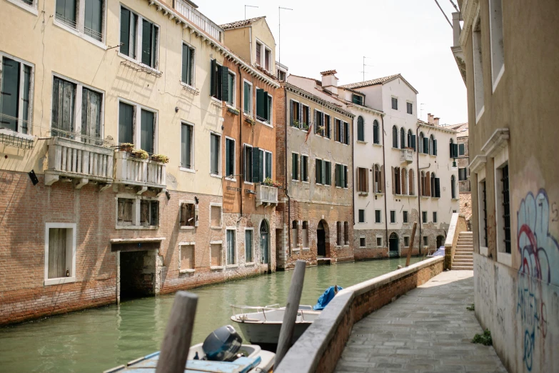 a boat that is sitting in the water, by Canaletto, pexels contest winner, visual art, shady alleys, white, empty streetscapes, portra
