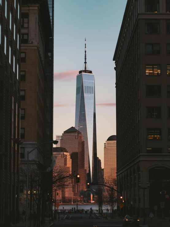 a very tall building sitting in the middle of a city, pexels contest winner, 9/11, fan favorite, low quality photo, beatifully lit