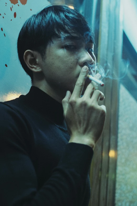 a man in a black shirt smokes a cigarette, inspired by Liam Wong, unsplash, hyperrealism, grainy movie still, ignant, actor, weed