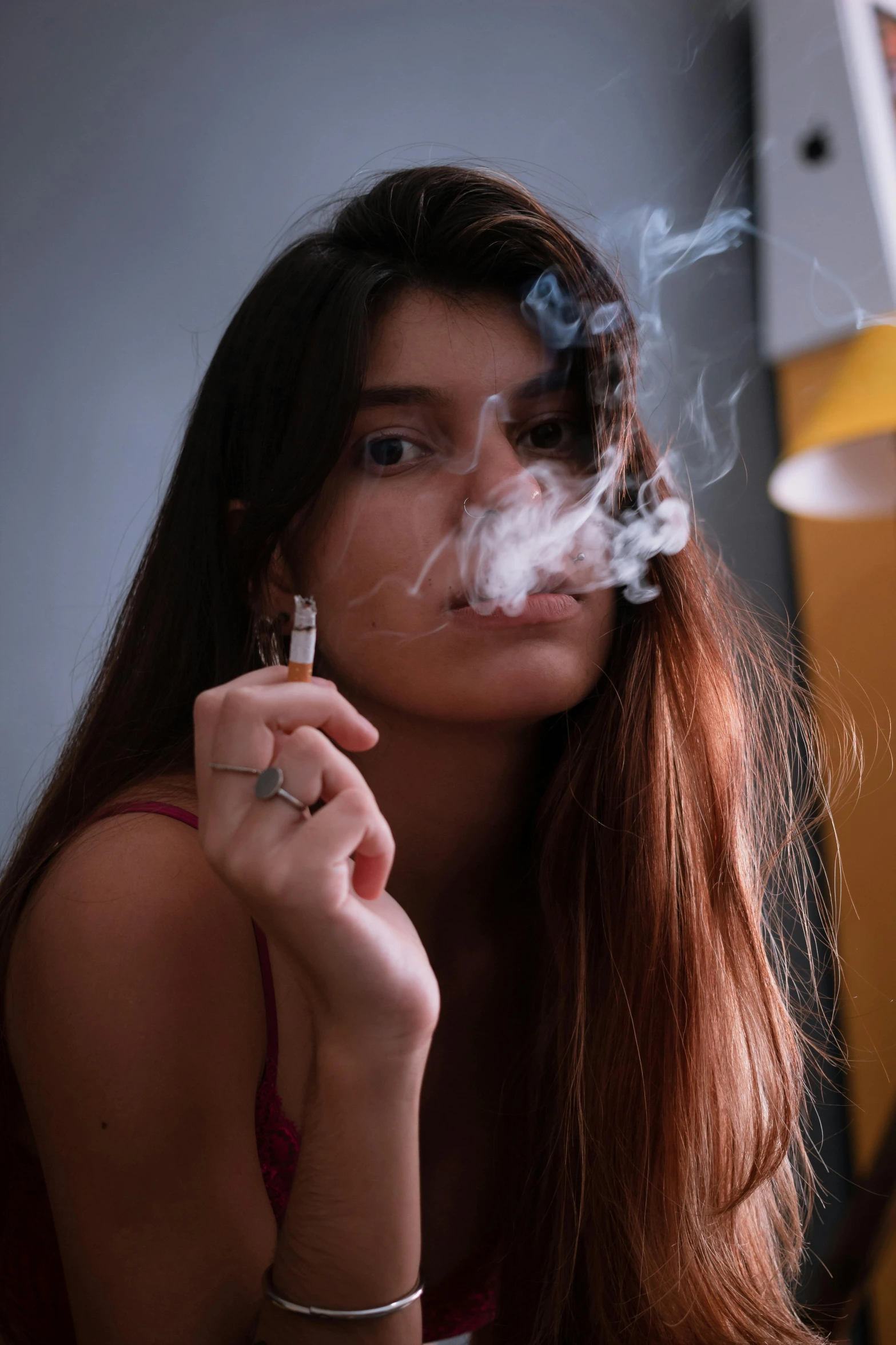 a woman smoking a cigarette in a room, highly upvoted, smoking a blunt, head shot, 2019 trending photo