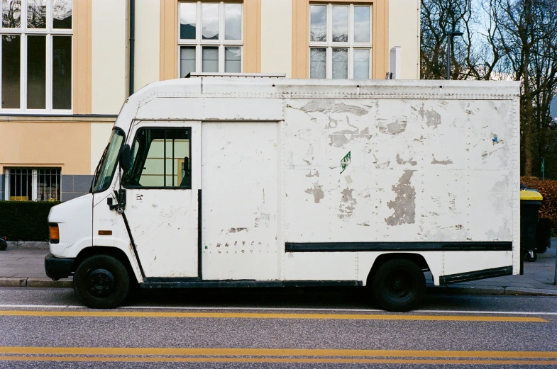 a white truck parked on the side of the road, unsplash, postminimalism, ready to eat, van, artisanal art, helsinki
