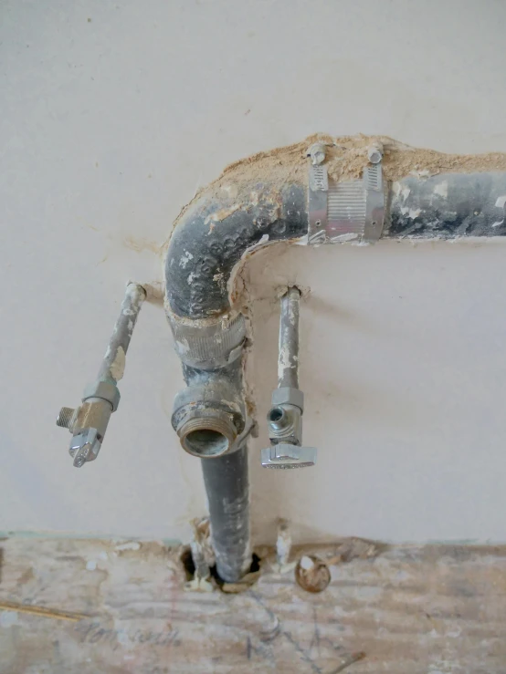 a close up of a pipe on a wall, pulled apart, sink, promo image, partially operational