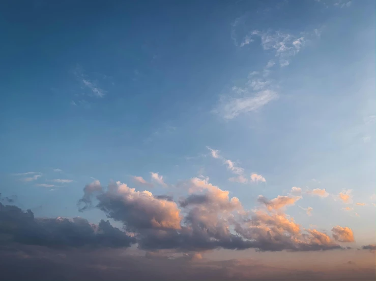 a couple of people on a beach flying a kite, unsplash, minimalism, sunset clouds, cumulus clouds, panorama view of the sky, pink clouds