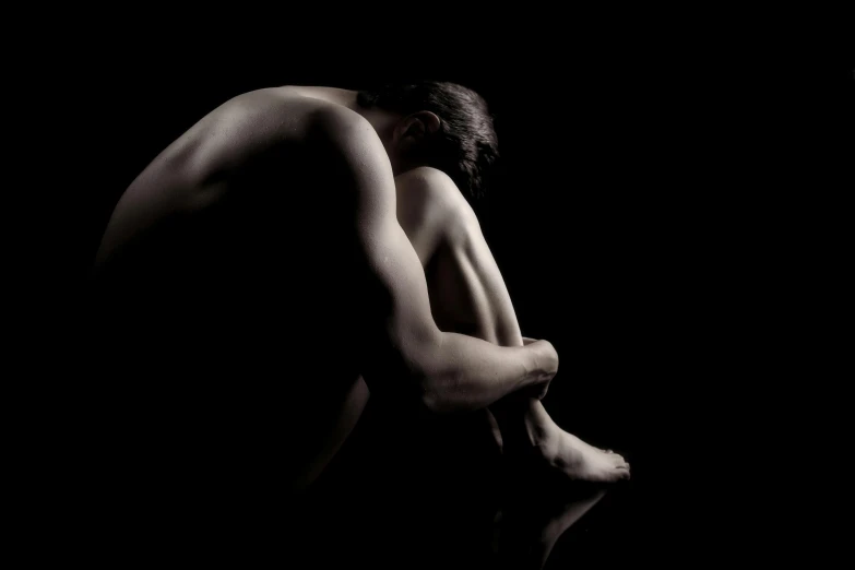 a black and white photo of a naked man, an album cover, by Maciej Kuciara, flickr, figurative art, emotional pain, on her knees, deep in thought, caravaggio style