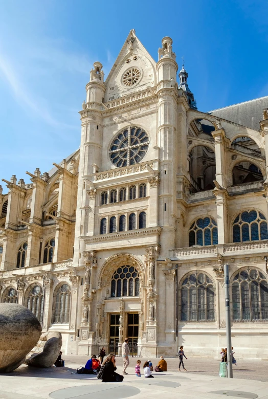 a large building with a statue in front of it, flying buttresses, ivory, onyx, lots de details