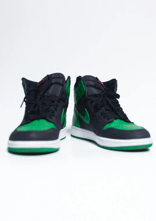 a pair of black and green sneakers on a white background, an album cover, unsplash, miles morales, hyperreal highly detailed 8 k, air jordan 1 high, ebay listing thumbnail