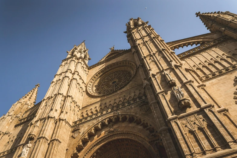 a very tall building with a clock on it's side, by Matteo Pérez, pexels contest winner, baroque, cathedral of sun, seville, front and side views, looking from slightly below