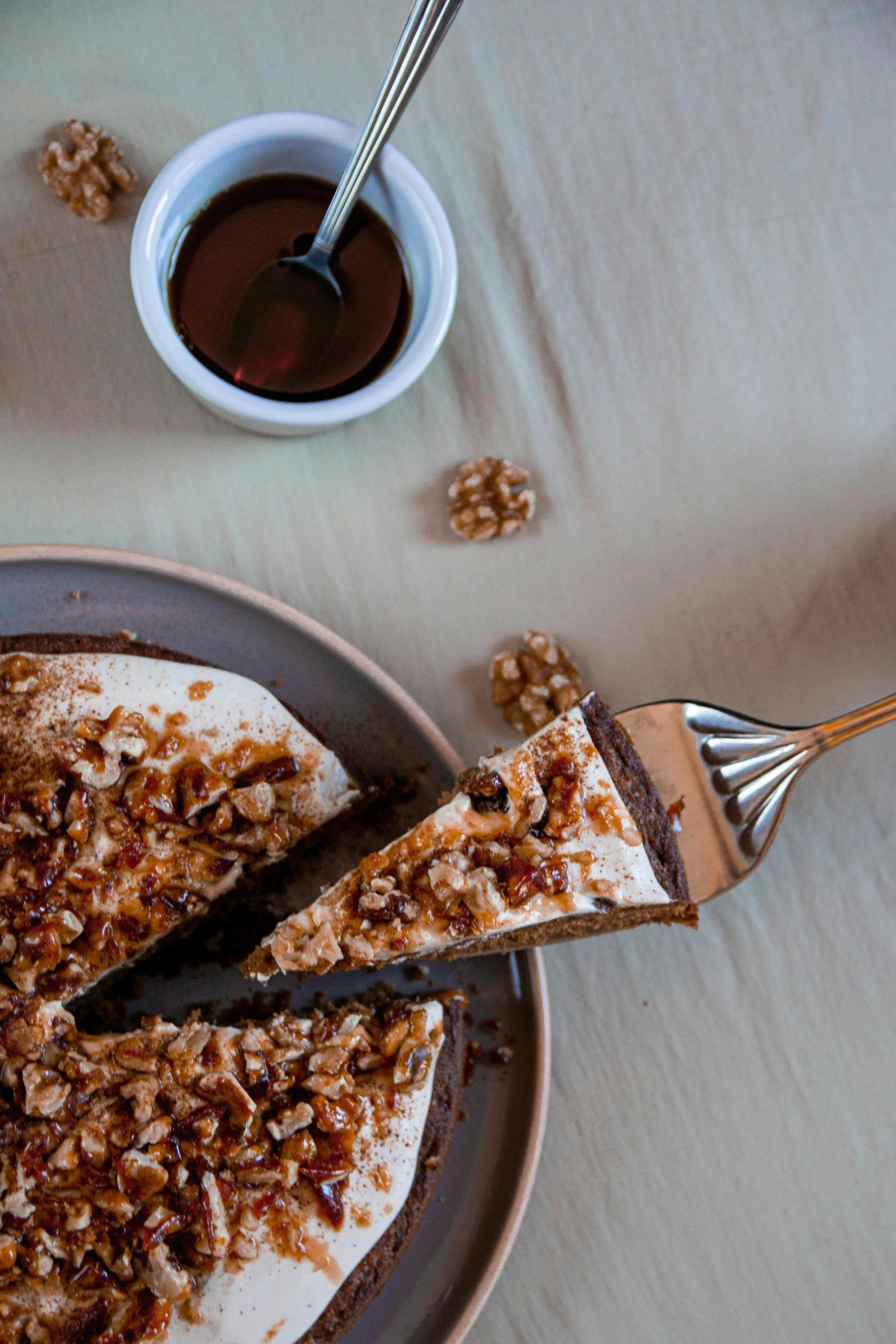 a cake sitting on top of a plate on a table, by Jan Tengnagel, pexels contest winner, walnuts, cold brew coffee ), thumbnail, chile