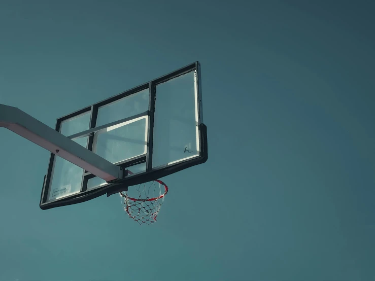 a basketball hoop with a blue sky in the background, pexels contest winner, hyperrealism, dark. no text, rectangle, a green, desaturated