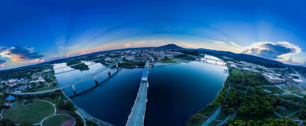 a panoramic view of a bridge over a body of water, looking over west virginia, photography shot at blue hour, cornell, 4k photo gigapixel