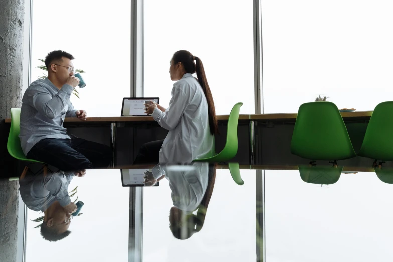 two people sitting at a table with a laptop, by Julian Allen, pexels contest winner, medical research facility, reflective floor, avatar image, royal commission