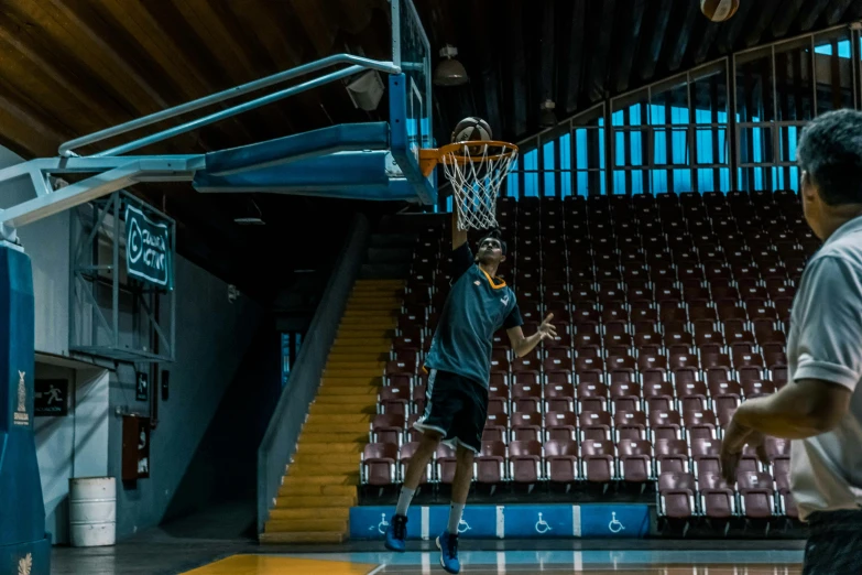 a group of men playing a game of basketball, shot on sony a 7, professional image, dunking, sportspalast amphitheatre