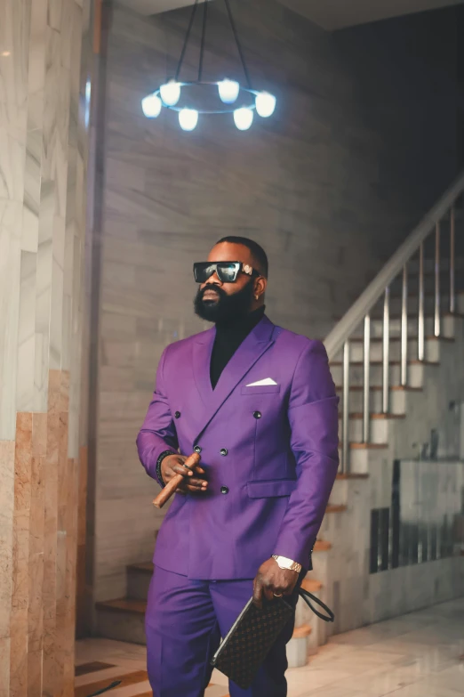 a man in a purple suit holding a gun, an album cover, trending on pexels, thick black beard, mc ride, thicc build, ( ( theatrical ) )