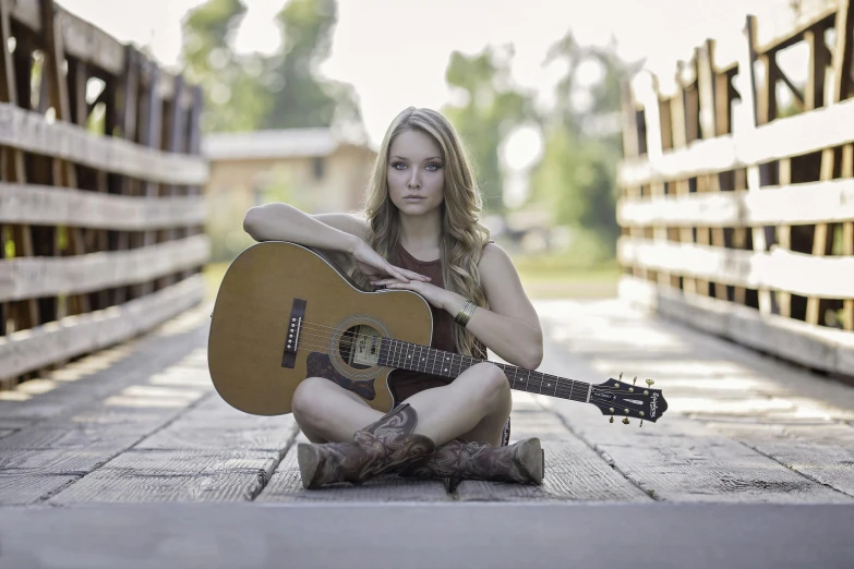 a woman sitting on the ground with a guitar, portrait of maci holloway, profile image, trending photo, square