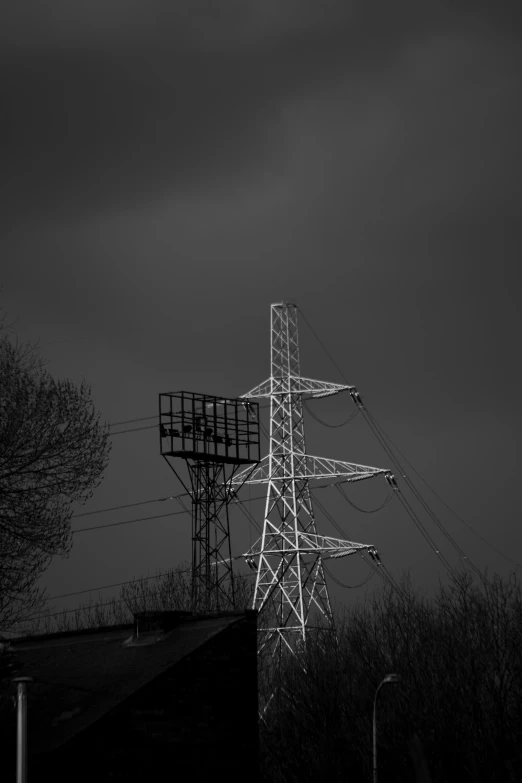 a black and white photo of power lines, a black and white photo, by Sven Erixson, postminimalism, dark moody light, watch tower, industrial colours, elstree