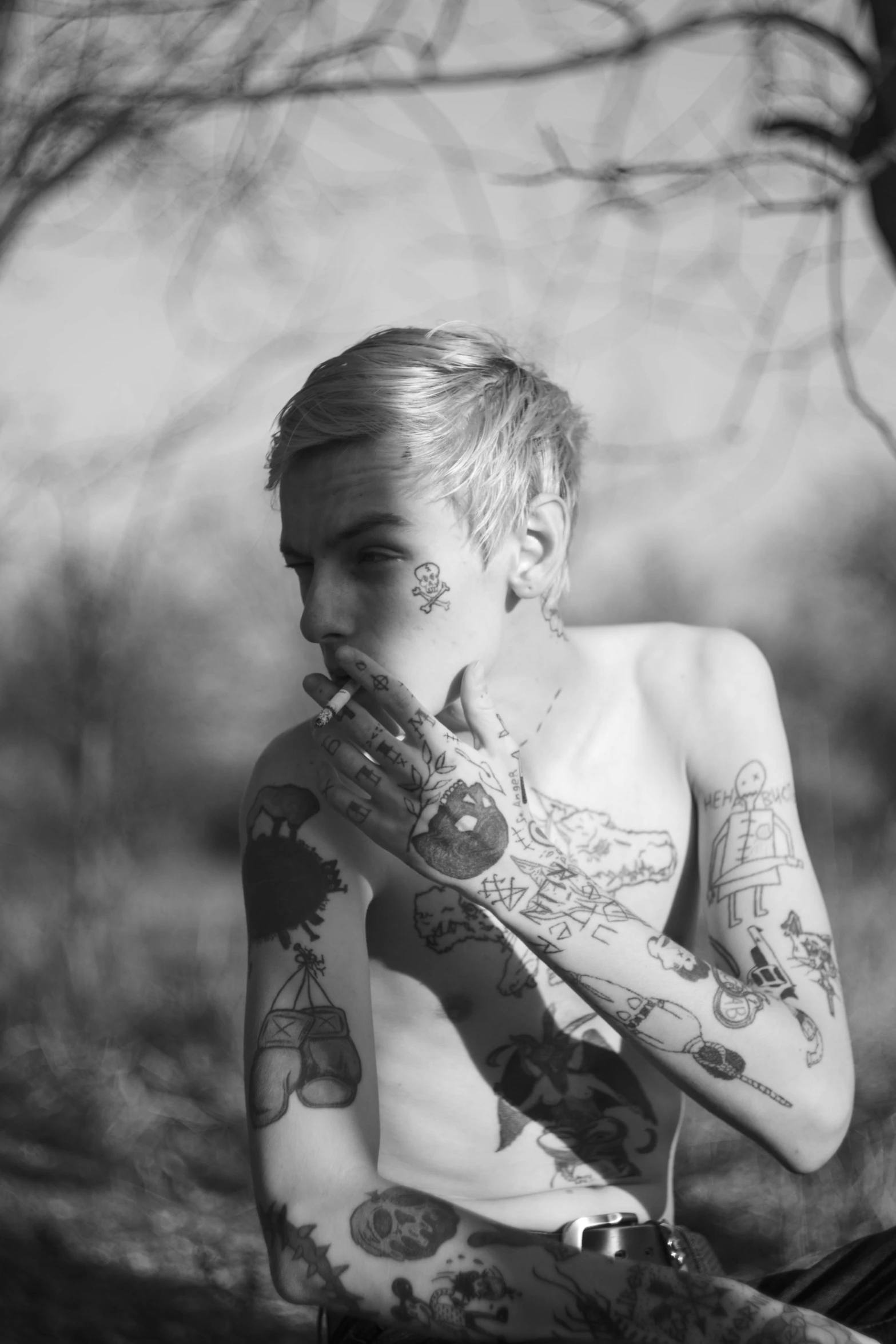 a black and white photo of a woman with tattoos, inspired by Seb McKinnon, tumblr, the non-binary deity of spring, short platinum hair tomboy, elven male, sun down