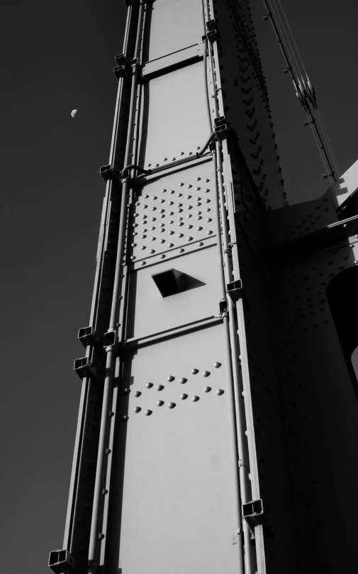 a black and white photo of the golden gate bridge, a black and white photo, inspired by Alexander Rodchenko, unsplash, brutalism, painted metal, hoog detail, guillotine, industrial colours