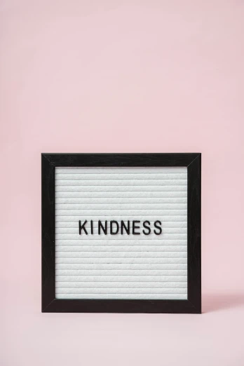 a sign that says kindness against a pink background, a picture, lightbox, 1 6 x 1 6, diverse, black-and-white