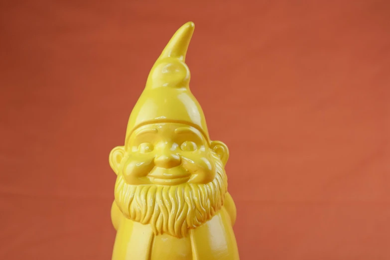 a close up of a yellow statue of a gnome, inspired by Sarah Lucas, trending on polycount, pop art, happy trippy mood, professional product photo, 1987, gnomon