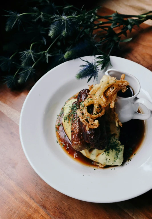 a close up of a plate of food on a table, a picture, by Jessie Algie, unsplash, romanticism, mashed potatoes and gravy, kete butcher, smoked layered, fashionable