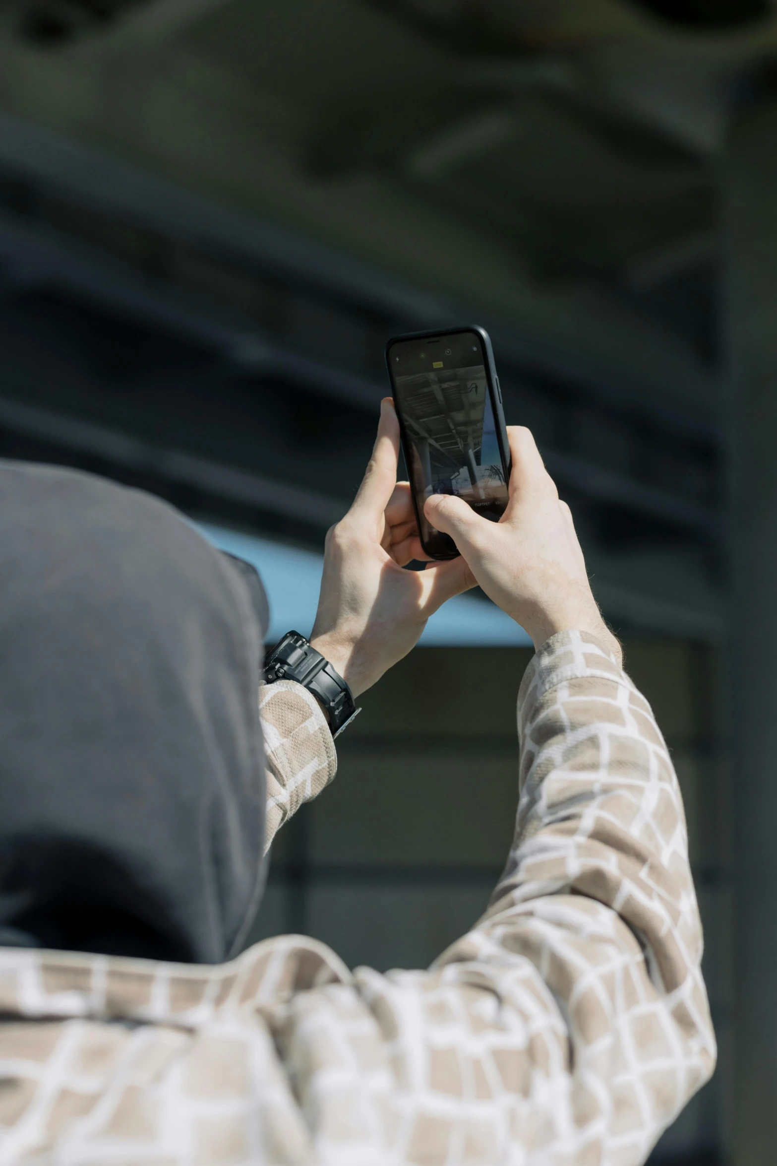 a person taking a picture of a giraffe, a picture, by Matthias Stom, unsplash, graffiti, black hoodie techie, mobile still frame. 4k uhd, multiple stories, in front of a garage