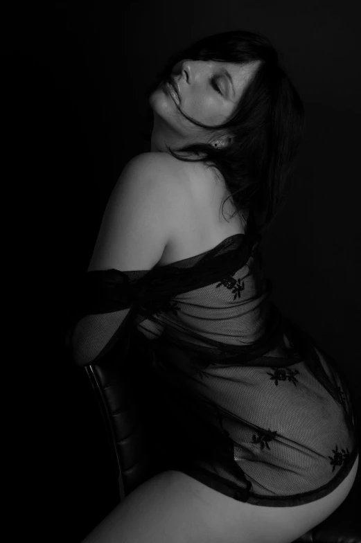 a black and white photo of a woman in lingerie, a black and white photo, ((restrained)), dark themed, photograph taken in 2 0 2 0, wrapped in black