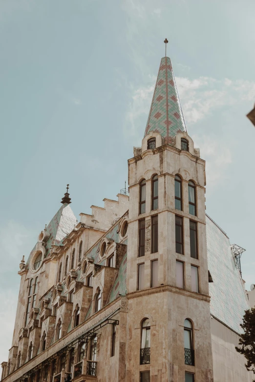 a tall building with a clock on top of it, inspired by Mihály Munkácsy, trending on unsplash, art nouveau, conversano, churches, sunfaded, exterior view