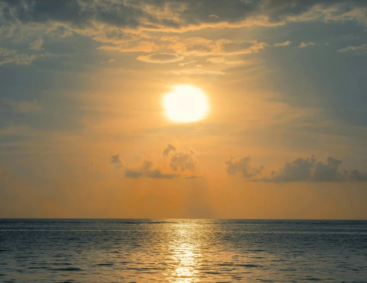 the sun is setting over a body of water, pexels contest winner, exotic endless horizon, halogen, midday sun, bali