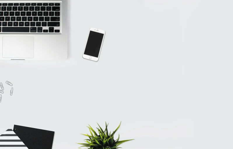 a laptop computer sitting on top of a white desk, a photo, minimalism, phone wallpaper, sparse plants, background image, hd artwork