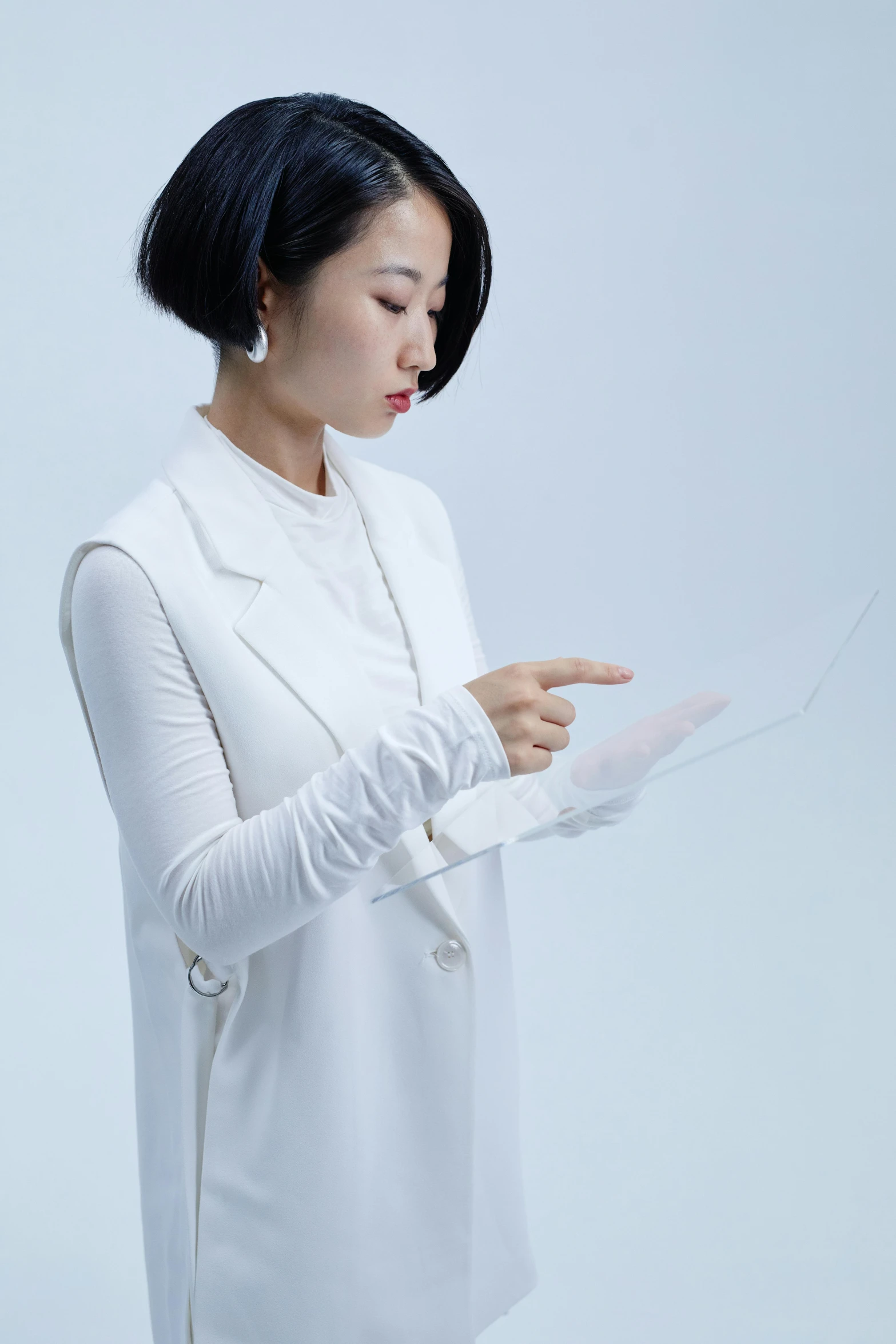 a woman in a white shirt holding a piece of paper, an album cover, inspired by Feng Zhu, using a magical tablet, scaled arm, clear outfit design, product introduction photo