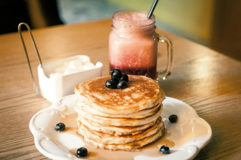 a stack of pancakes sitting on top of a white plate, a portrait, unsplash, juice, blueberry, japanese akihabara cafe, background image