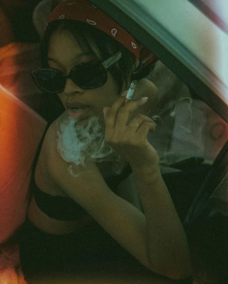 a woman in a bikini smoking a cigarette, inspired by Elsa Bleda, trending on pexels, sitting in her car, sza, mdma, smoke :6