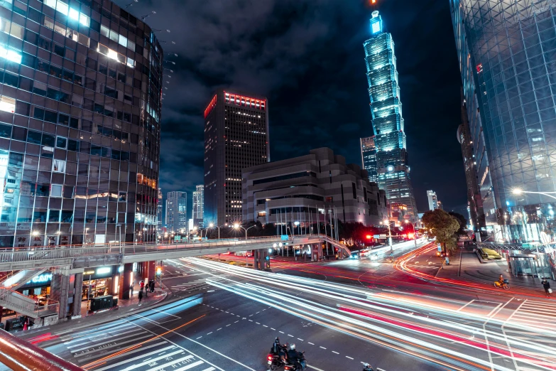 a city street filled with lots of traffic at night, pexels contest winner, taiwan, tall skyscrapers, instagram post, stacked image