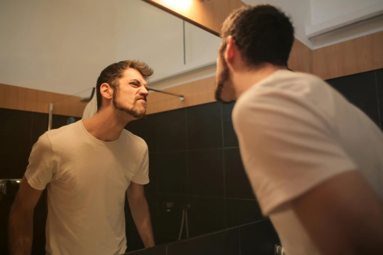 a man standing in front of a mirror brushing his teeth, by Adam Marczyński, pexels contest winner, renaissance, square masculine jaw, facing each other, 30 year old man, with his back turned