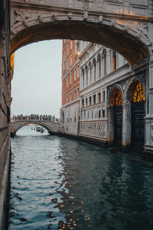 a bridge that is over a body of water, pexels contest winner, renaissance, many doorways, low quality photo, gondolas, full frame image