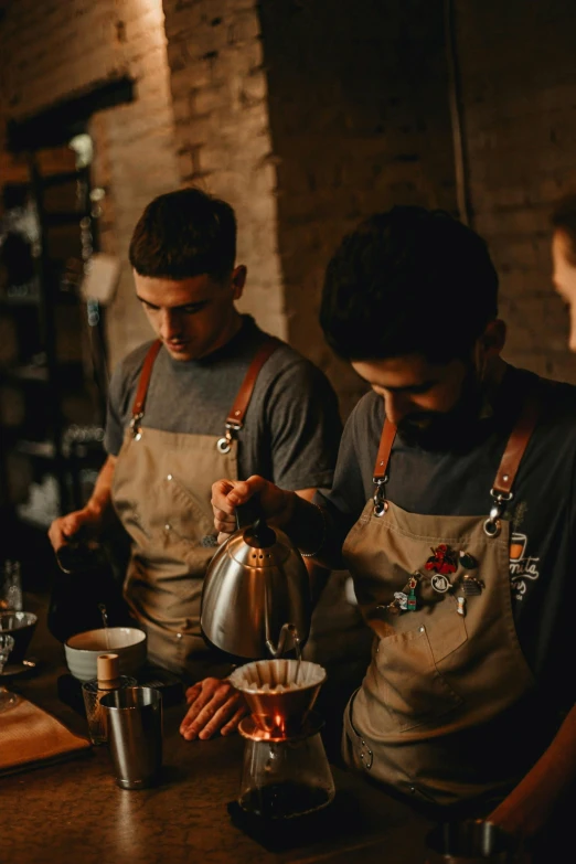 a group of men standing next to each other at a bar, pexels contest winner, process art, starbucks aprons and visors, pouring techniques, arabica style, moody setting