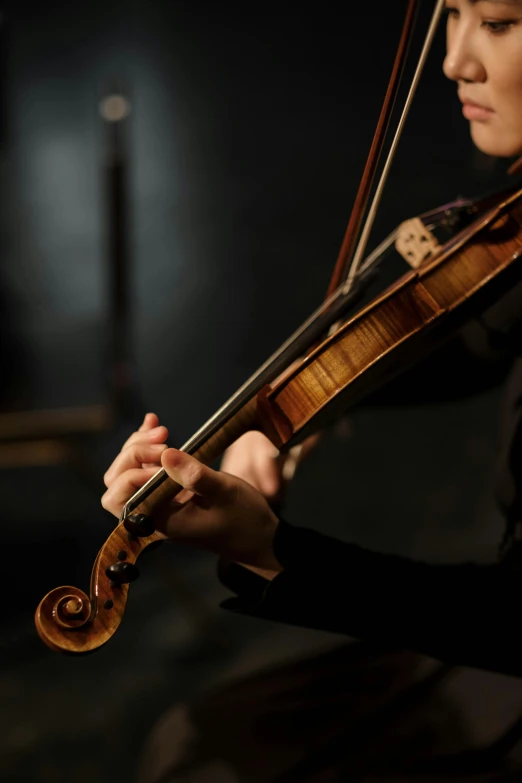 a woman playing a violin in a dark room, square, hands, strathmore 2 0 0, handcrafted