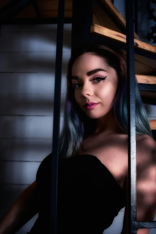 a woman with blue hair sitting on a set of stairs, a portrait, inspired by Elsa Bleda, trending on pexels, behind bars, 8 k sensual lighting, low quality photo, violet myers