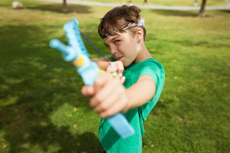 a close up of a person holding a bow and arrow, blippi, casual playrix games, action shots, liam brazier