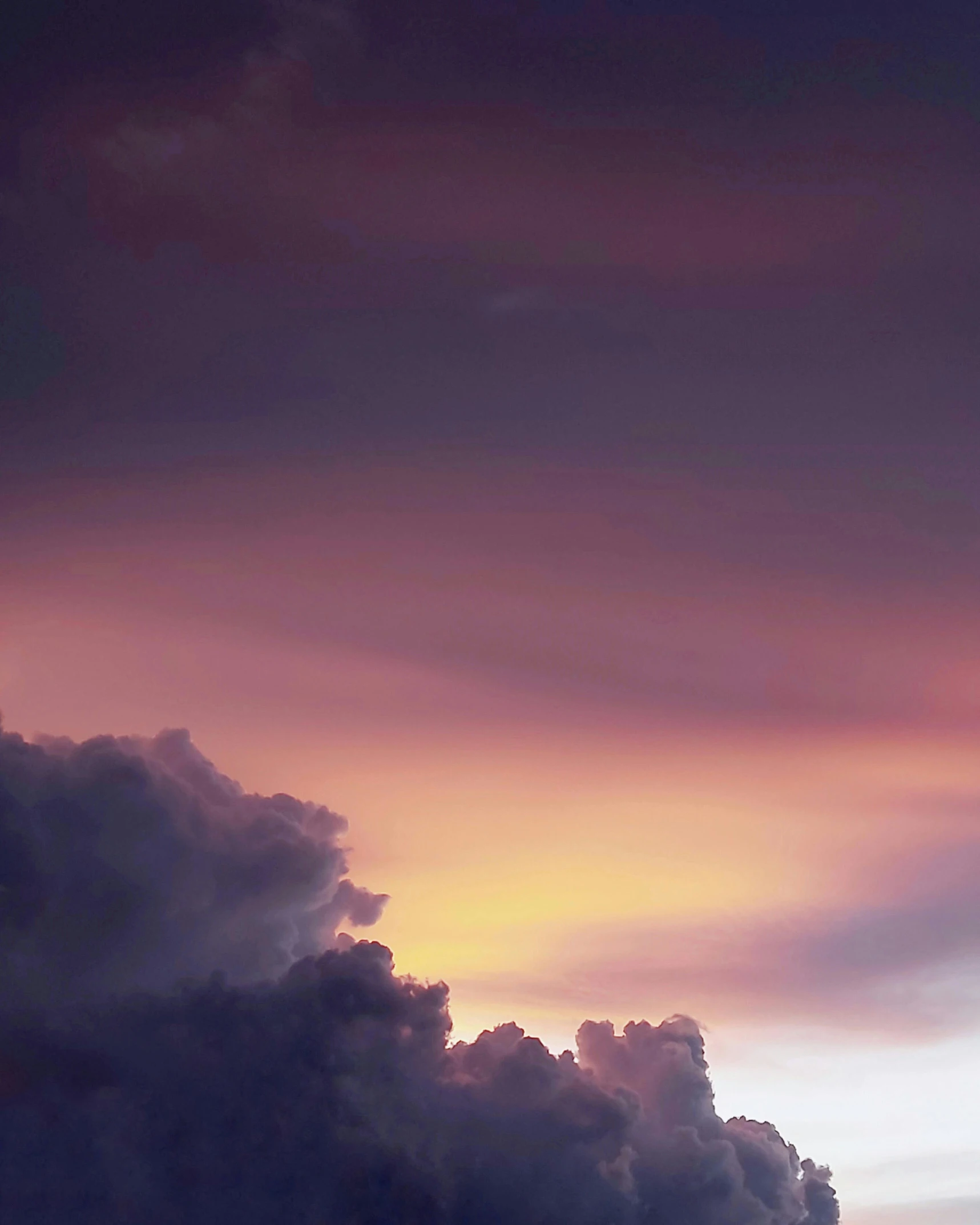 a plane flying through a cloudy sky at sunset, an album cover, unsplash, romanticism, cloud iridescence, dark purple clouds, ((sunset)), storm in the evening